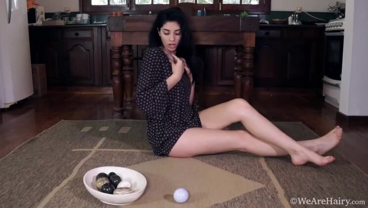 Solo hairy girl Ornella grinds on rough rocks